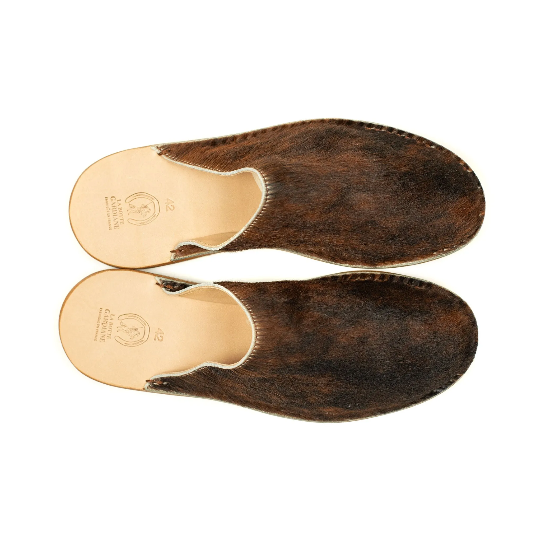 Exclusive mules in hair-on Normande calf