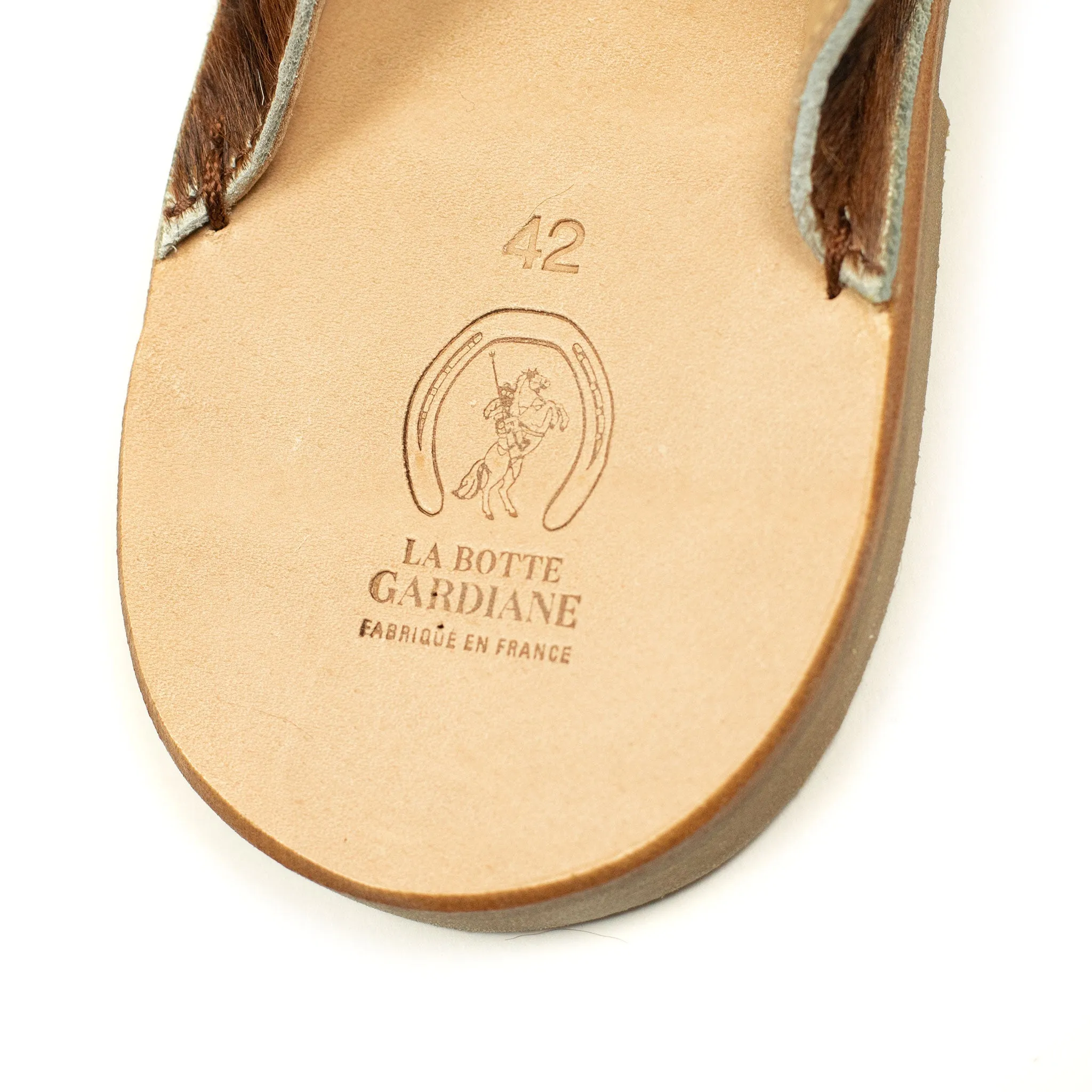 Exclusive mules in hair-on Normande calf